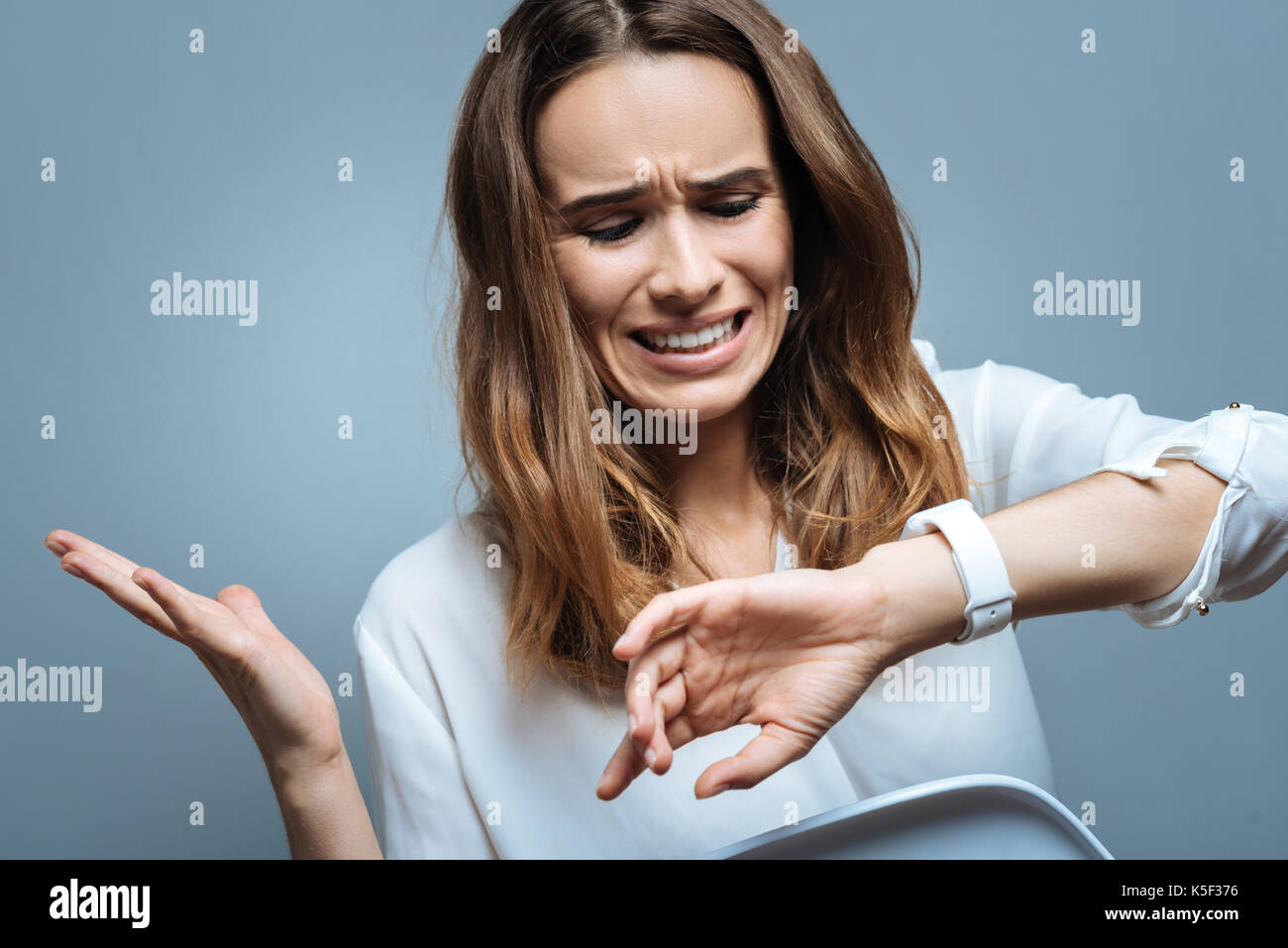 Cheerless unhappy woman missing her appointment Stock Photo - Alamy