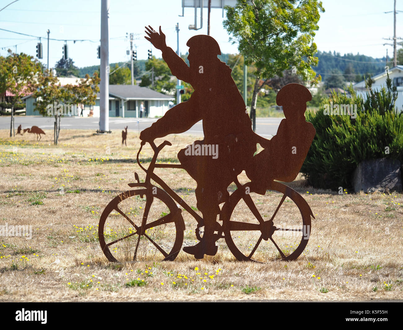 Bicyclist silhouette art in Raymond WA, USA Stock Photo