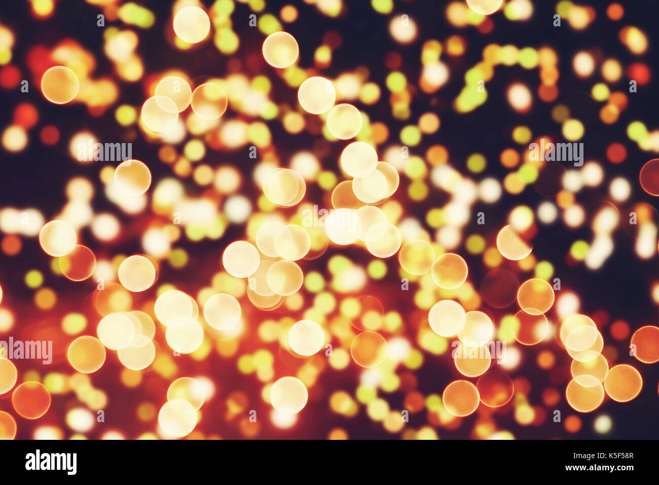 Festive background with natural bokeh and bright golden lights. Vintage ...