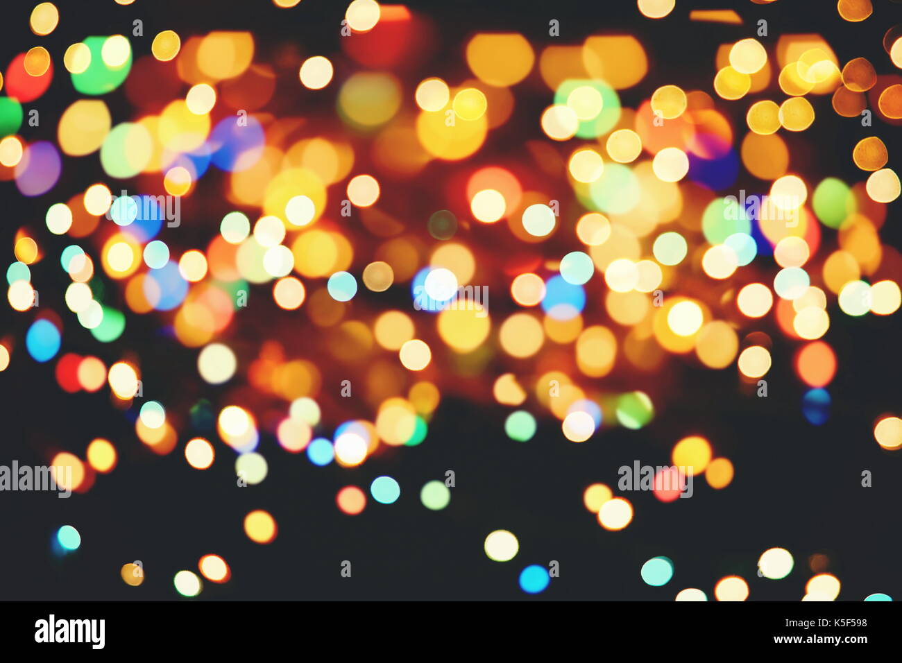 Festive background with natural bokeh and bright golden lights. Vintage ...