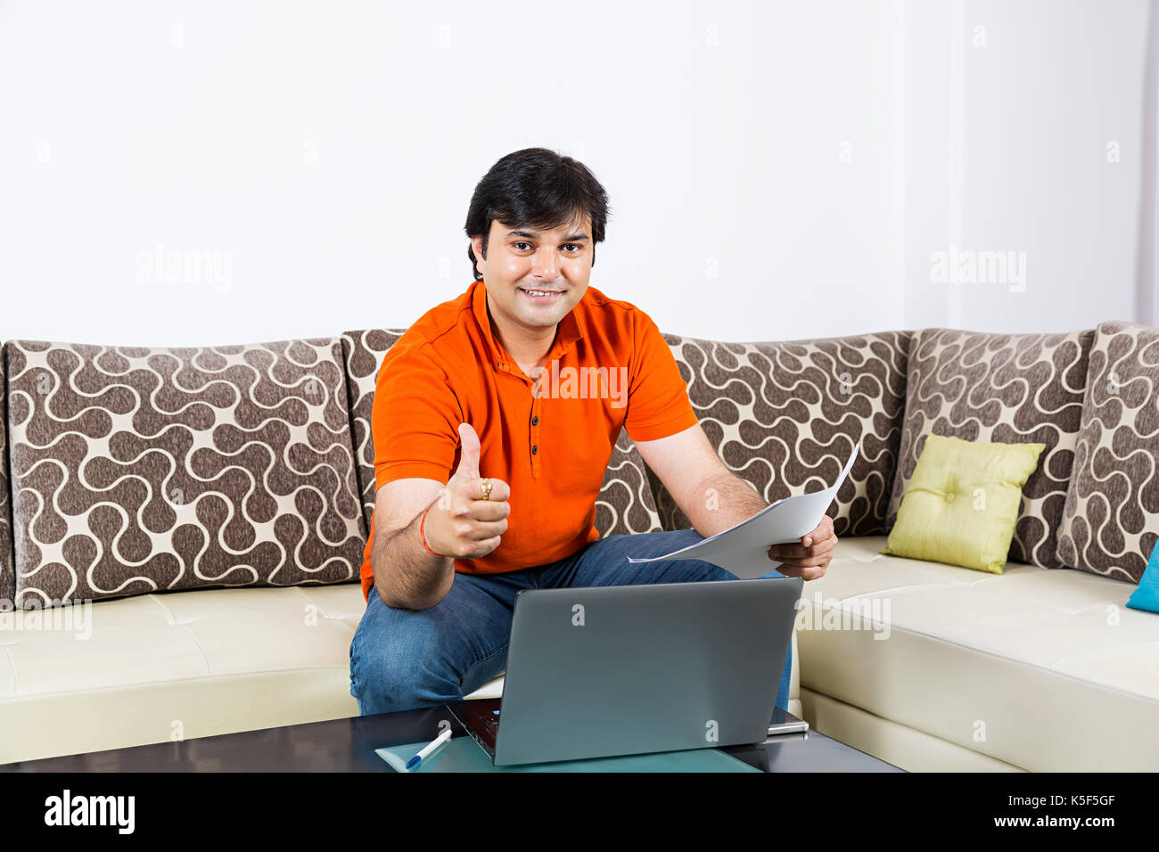 Indian Businessman Checking Contract Paper Dealing Success Thumbsup At home Stock Photo