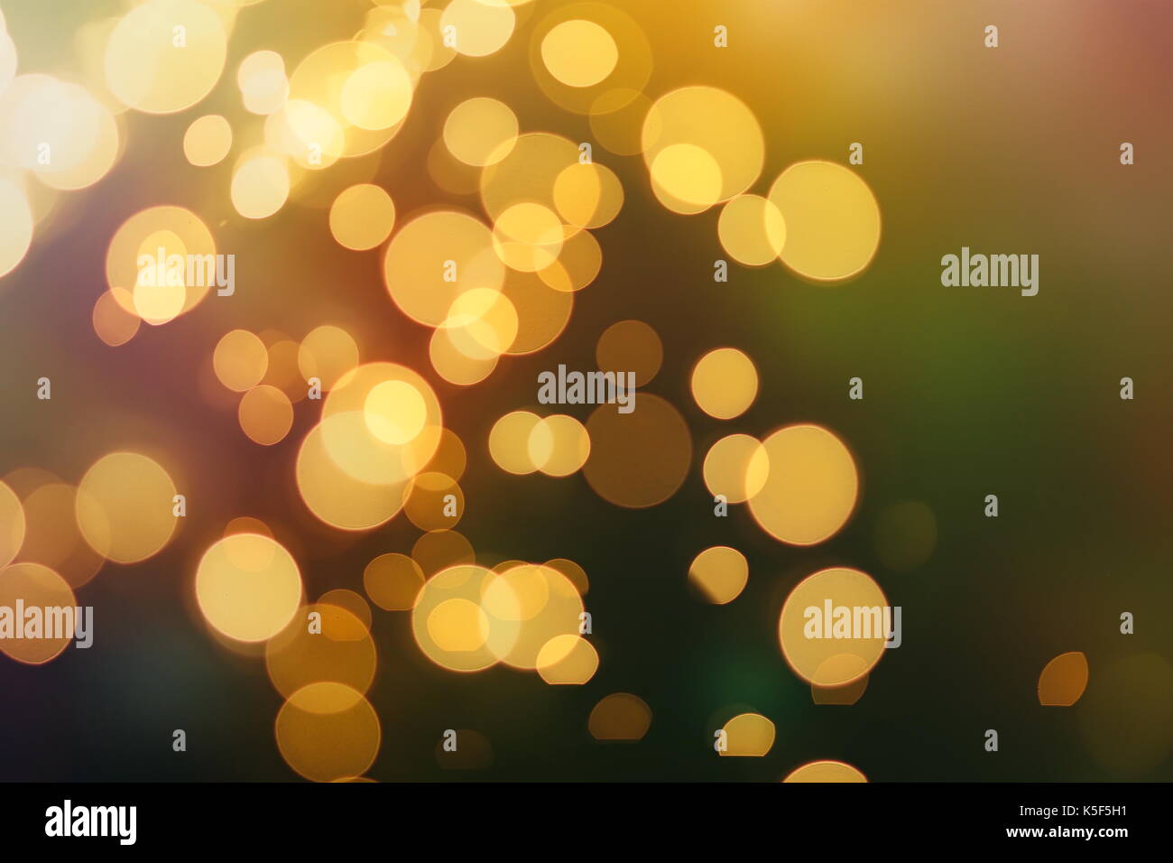 Festive background with natural bokeh and bright golden lights. Vintage ...