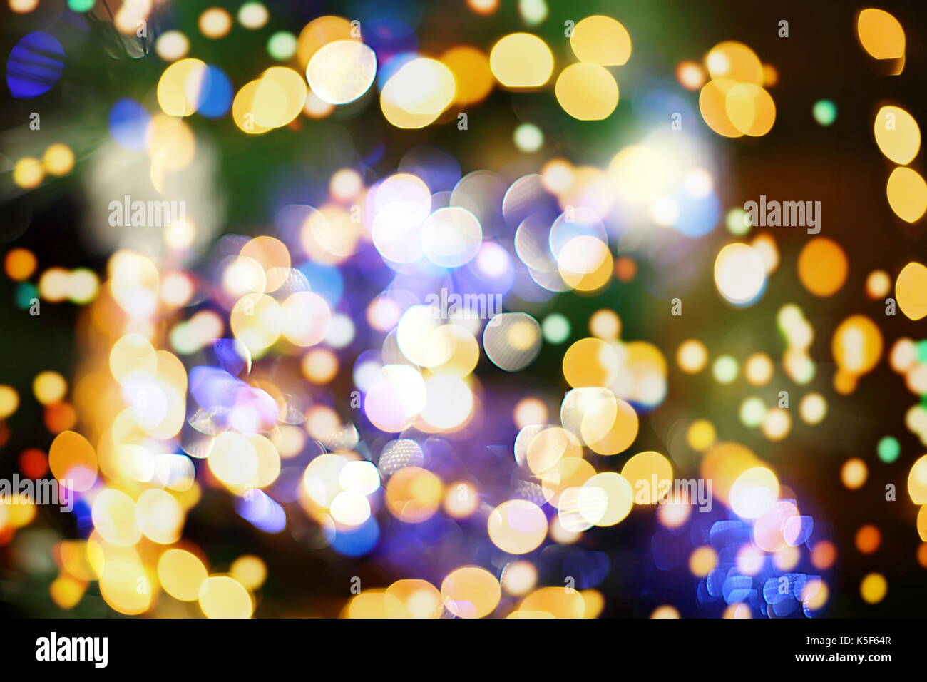 Festive background with natural bokeh and bright golden lights. Vintage ...
