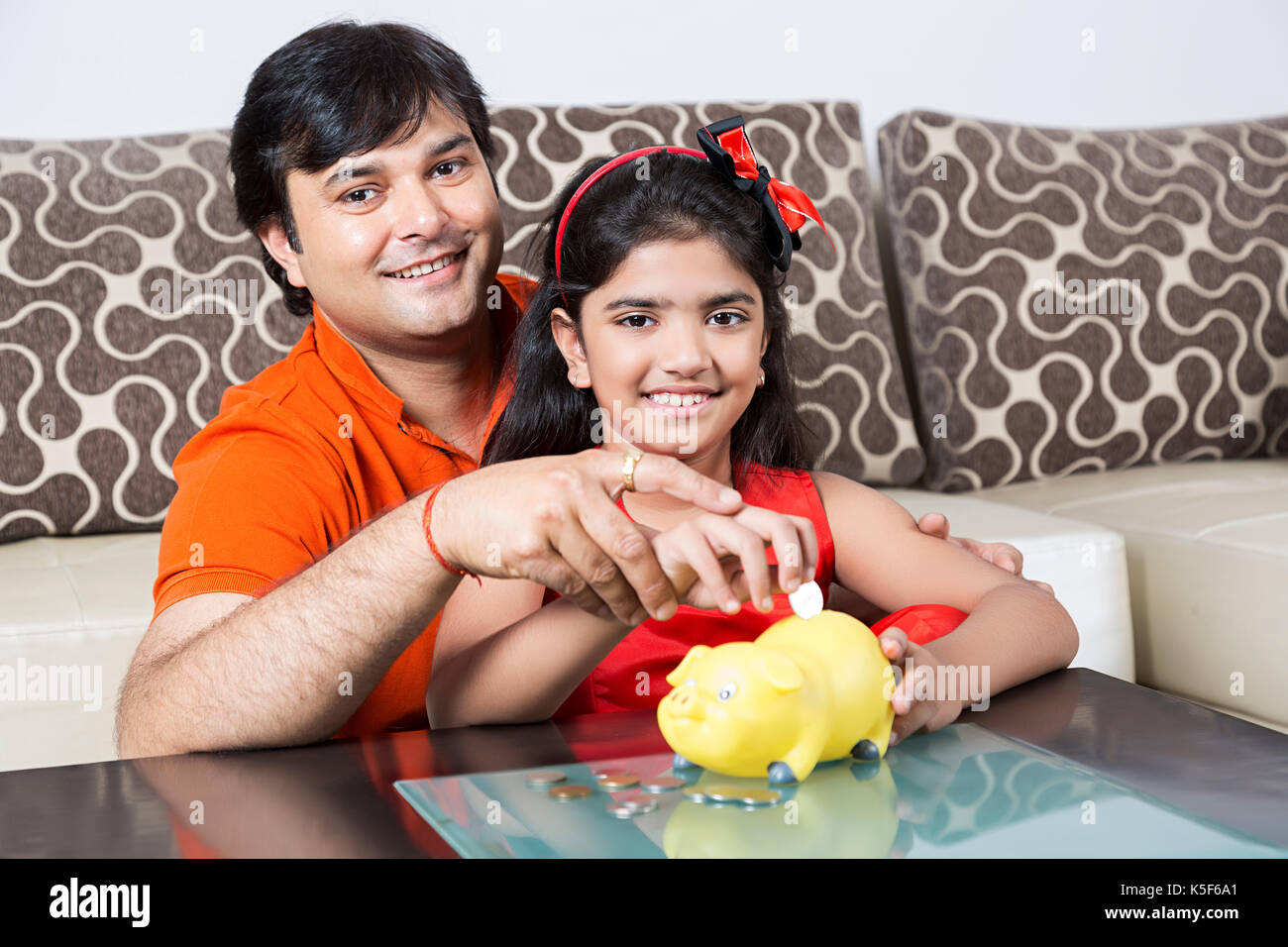 Indian Father And Little Daughter Saving Money Piggy Bank Future ...