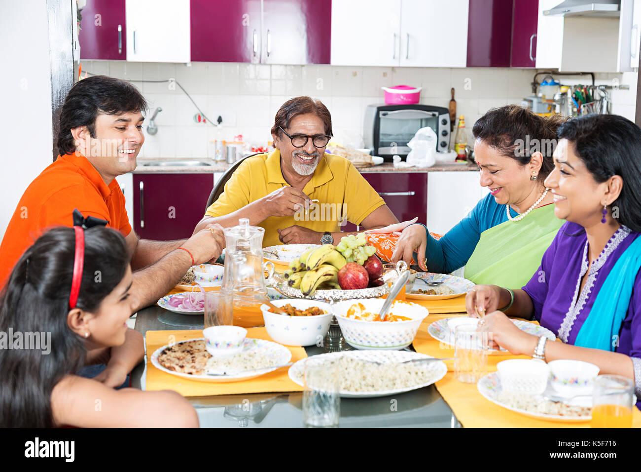 Indian Family Dining Table Eating Food Lunch At home Stock Photo