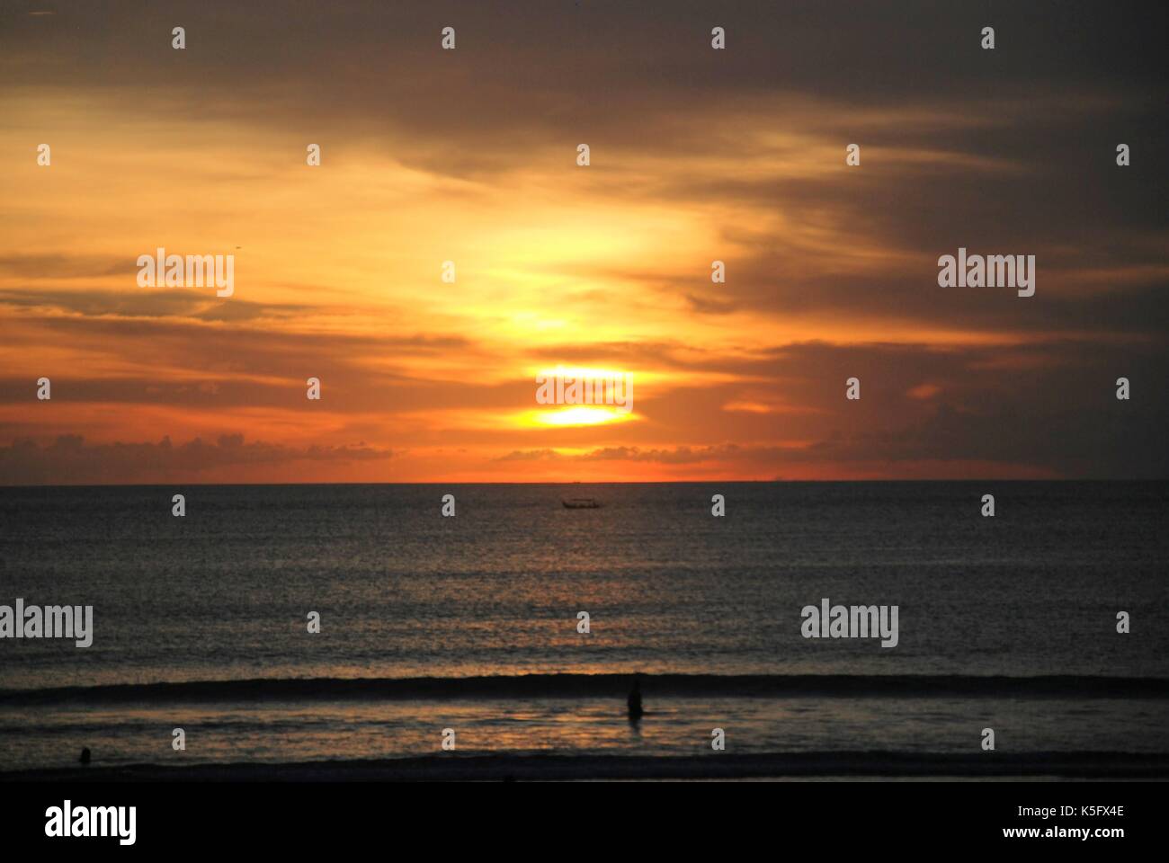 sunset view of a beach in bali, indonesia Stock Photo - Alamy