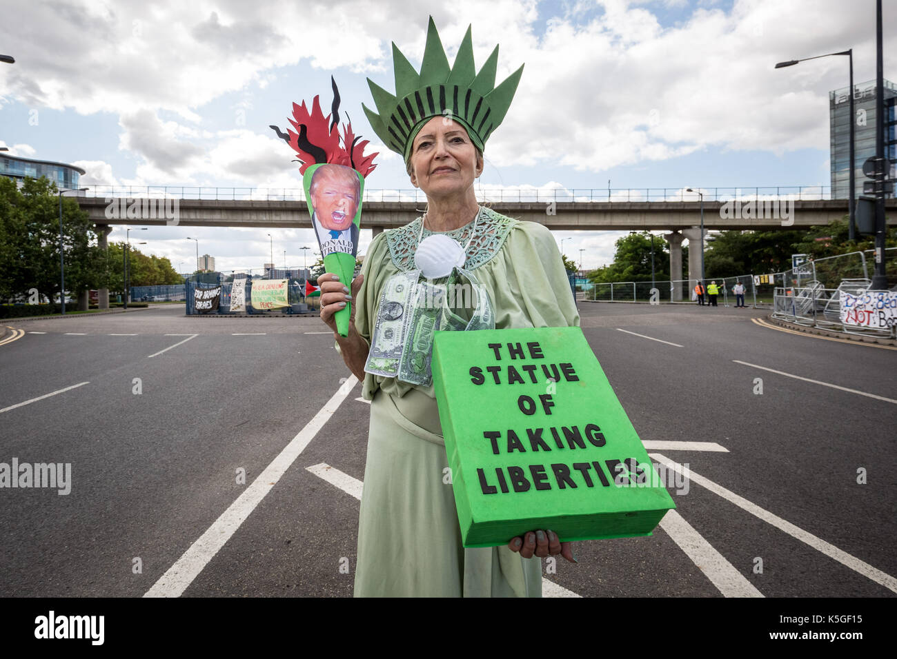 London, UK. 9th Sept, 2017. Protests continue against DSEi Arms Fair (Defence & Security Equipment International) - the world's largest biggest arm fair at Excel Centre in east London. Activist Auriel Glanville, co-ordinator of Merton Friends of the Earth, protests near the east gate entrance dressed in her creation ‘The Statue of Taking Liberties’. Credit: Guy Corbishley/Alamy Live News Stock Photo