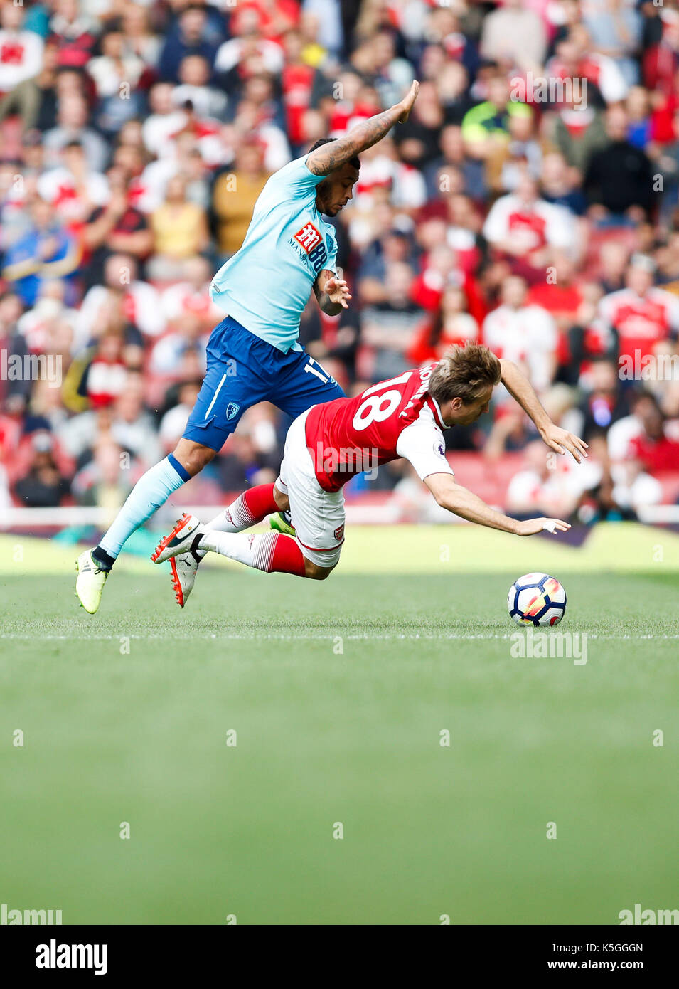 London, UK. 9th Sep, 2017. Nacho Monreal (R) of Arsenal is tackled during the English Premier League match between Arsenal and Bournemouth at the Emirates Stadium in London, Britain on Sept. 9, 2017.Credit: Han Yan/Xinhua/Alamy Live News Stock Photo