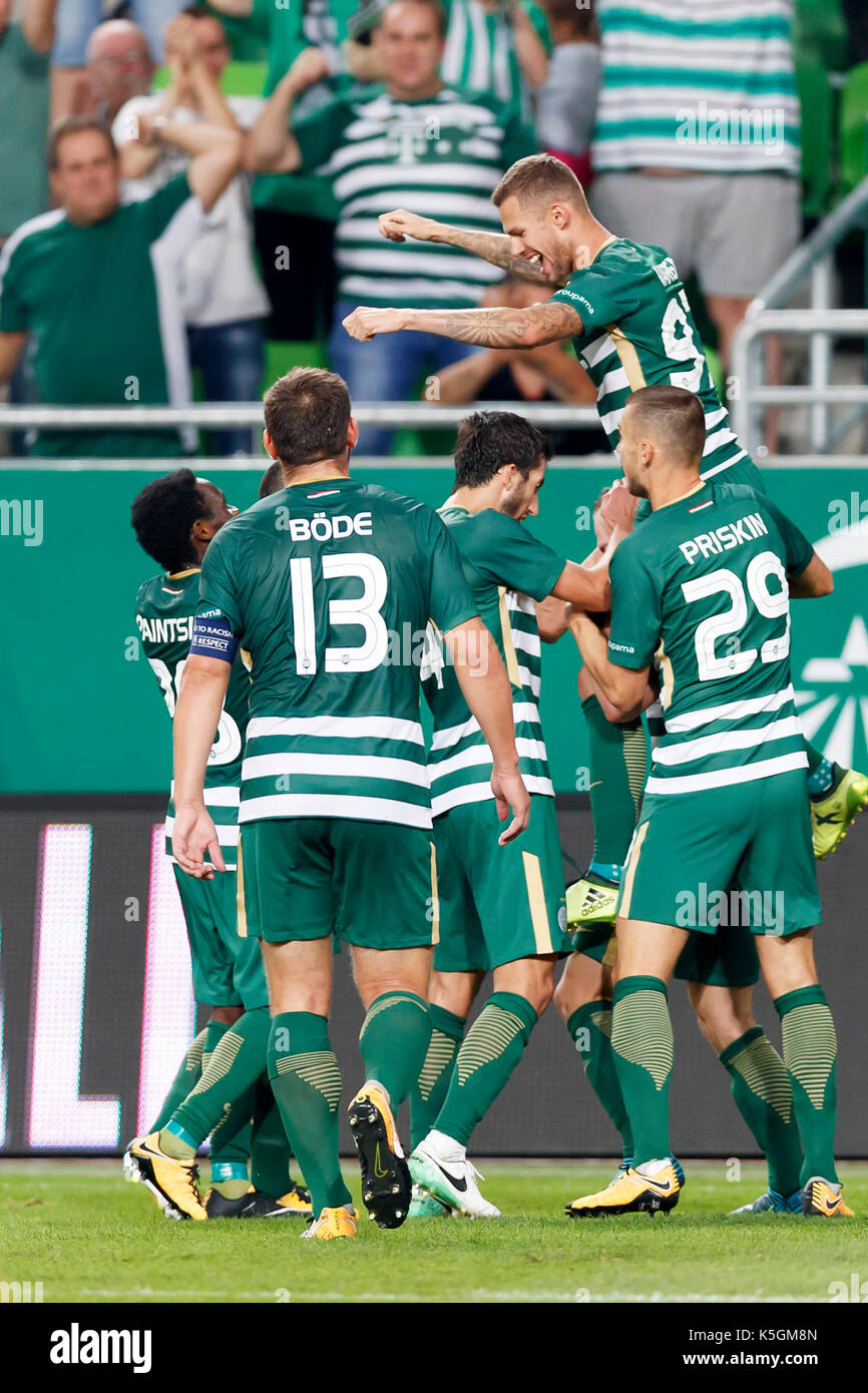 BUDAPEST, HUNGARY - JULY 12: (r-l) Roland Varga of Ferencvarosi TC hugs  goal scorer Stefan