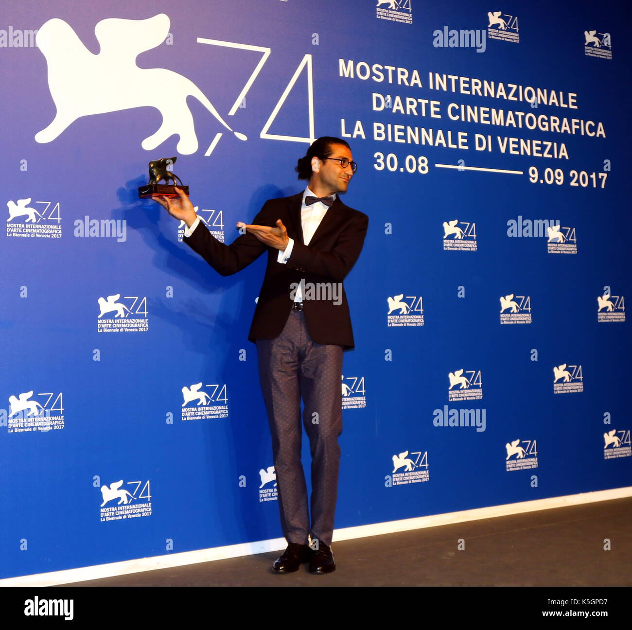 Venice, Italy. 9th September, 2017. Alireza Khatam poses with the Orizzonti Award for Best Screenplay Award for 'Los Versos Del Olvido' at the Award Photocall during the 74th Venice International Film Festival at Lido of Venice on 9th September, 2017. Credit: Andrea Spinelli/Alamy Live News Stock Photo
