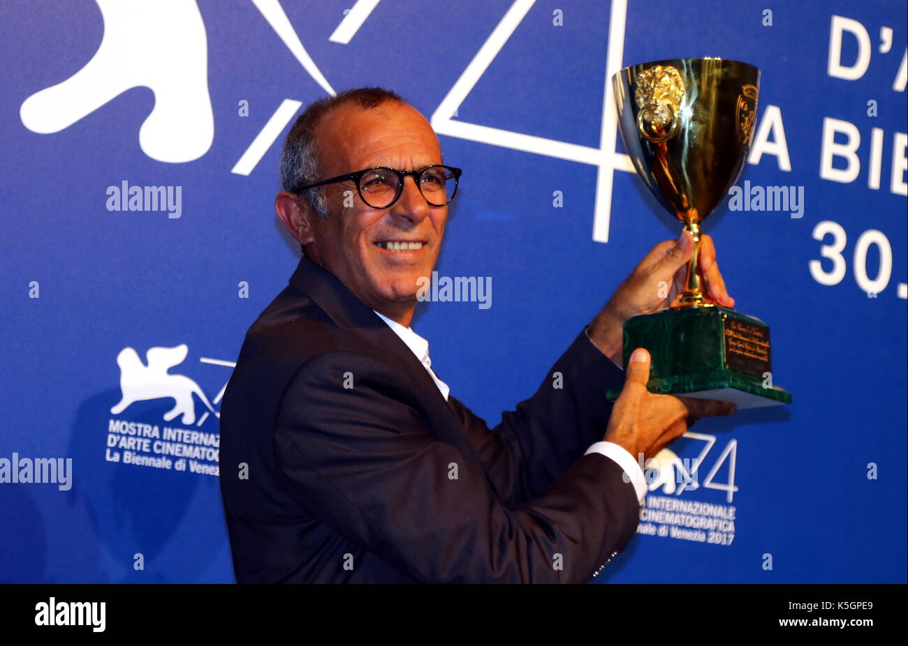 Venice, Italy. 9th September, 2017. Actor Kamel El Basha poses during a photocall after he receives the Coppa Volpi for Best Actor for his character in the movie 'The Insult' at the Award Photocall during the 74th Venice International Film Festival at Lido of Venice on 9th September, 2017. Credit: Andrea Spinelli/Alamy Live News Stock Photo