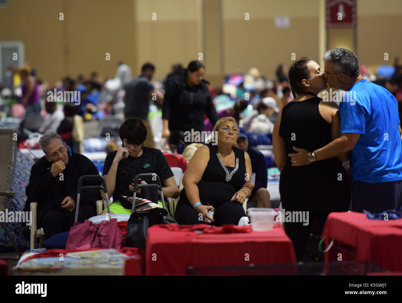 Miami, USA. 9th Sep, 2017. People are seen at a shelter at the Miami-Dade County Fair Expo Center in Miami, as hurricane 'Irma' is approaching, in Miami, Florida, the United States, Sept. 9, 2017. About 5.6 million people in Florida have been ordered to evacuate, while 54,000 Floridians have taken shelter in 320 shelters across Florida. Forecasters expect the hurricane to hit Florida early Sunday morning. Credit: Yin Bogu/Xinhua/Alamy Live News Stock Photo