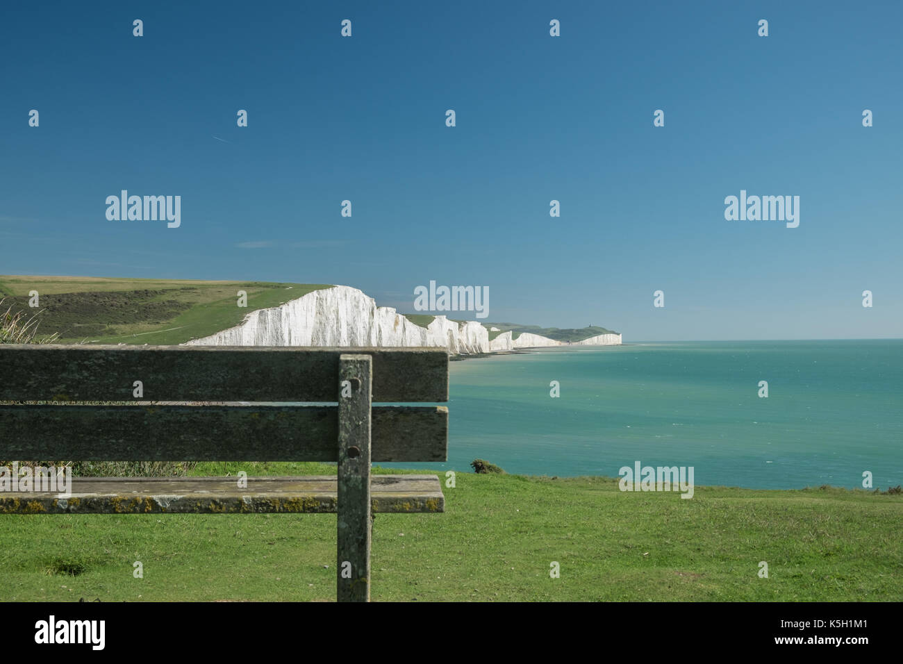 Wooden bench with the view of Seven Sisters cliffs Stock Photo