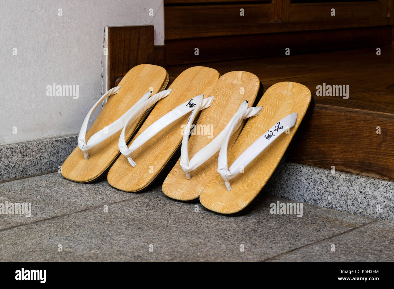 Japan - June 3, 2017:  Vintage Japanese slippers with names, zori, waiting in front of the temple Stock Photo