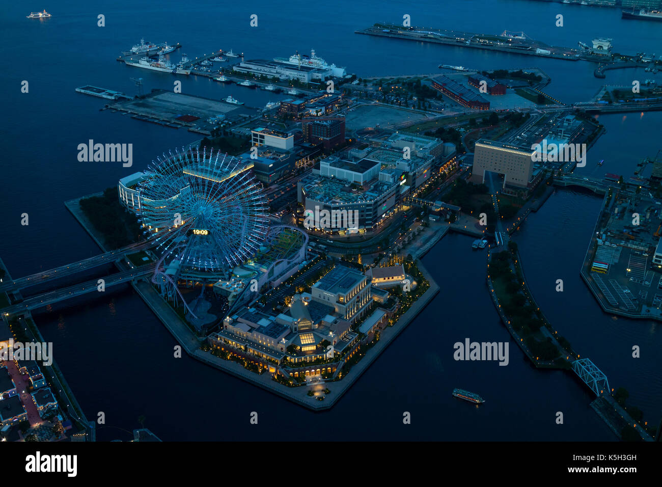 Yokohama, Japan - June 15, 2017: View from the Landmark Tower at night to the Yokohama Cosmo World Amusement Park and harbour Stock Photo