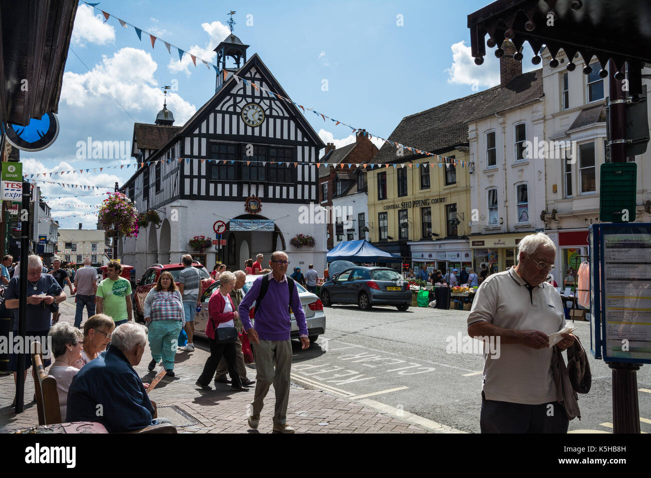 A candid street scene of ordinary people going about their business in High Town, Bridgnorth, Shropshire, UK. Saturday market. Stock Photo