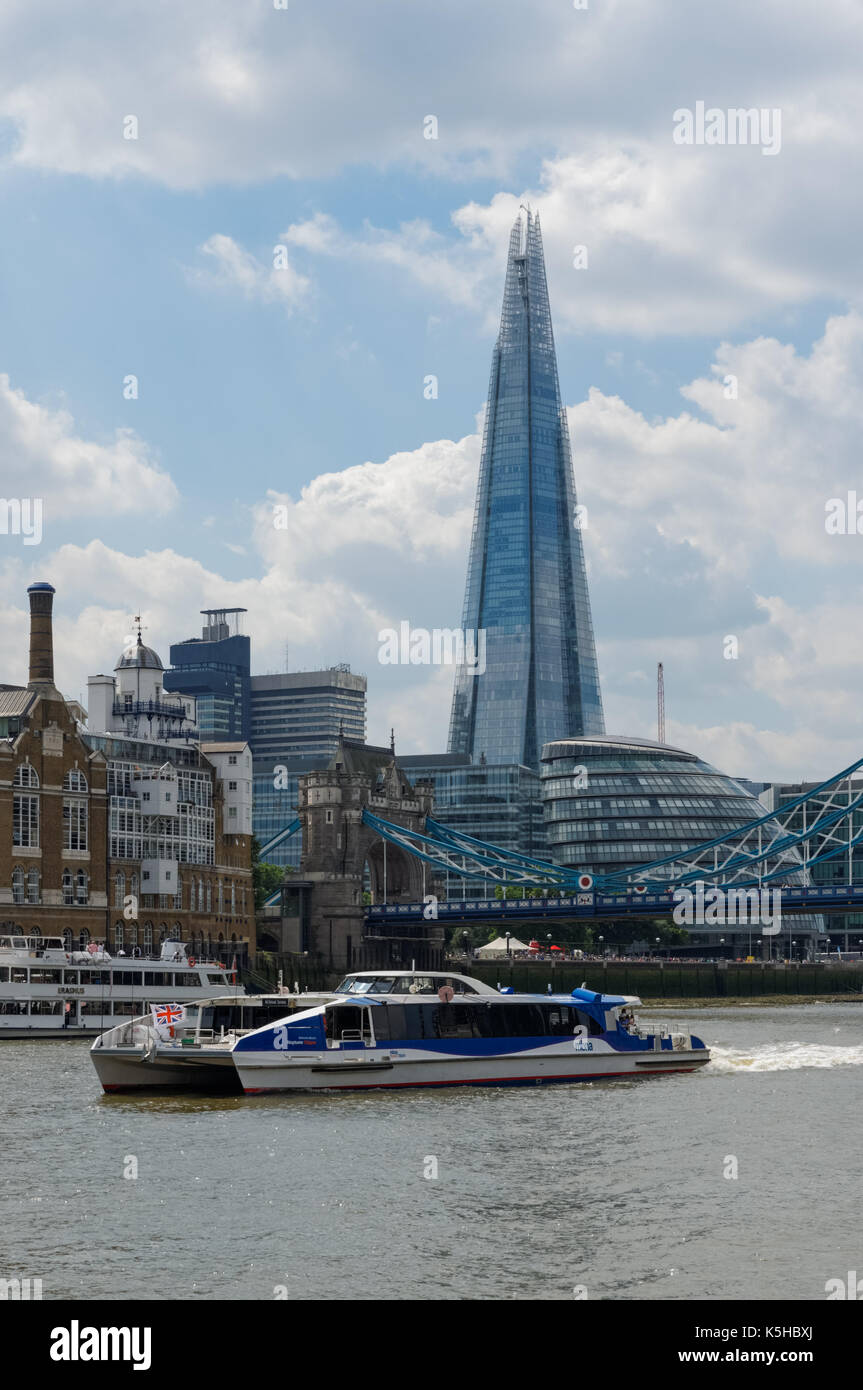 Thames clipper on the River Thames with Shard skyscraper in the background, London England United Kingdom UK Stock Photo