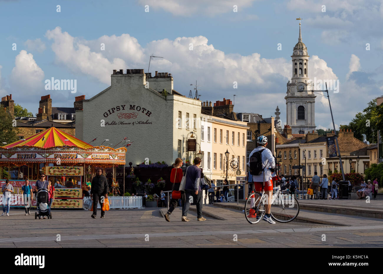People on Greenwich Church Street with St Alfege church in the background, London, England, United Kingdom, UK Stock Photo