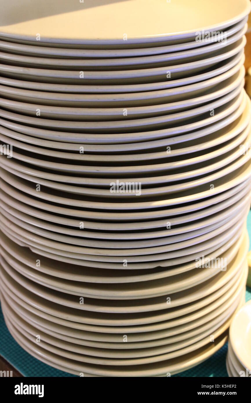 Close up of empty plates lying one over another Stock Photo