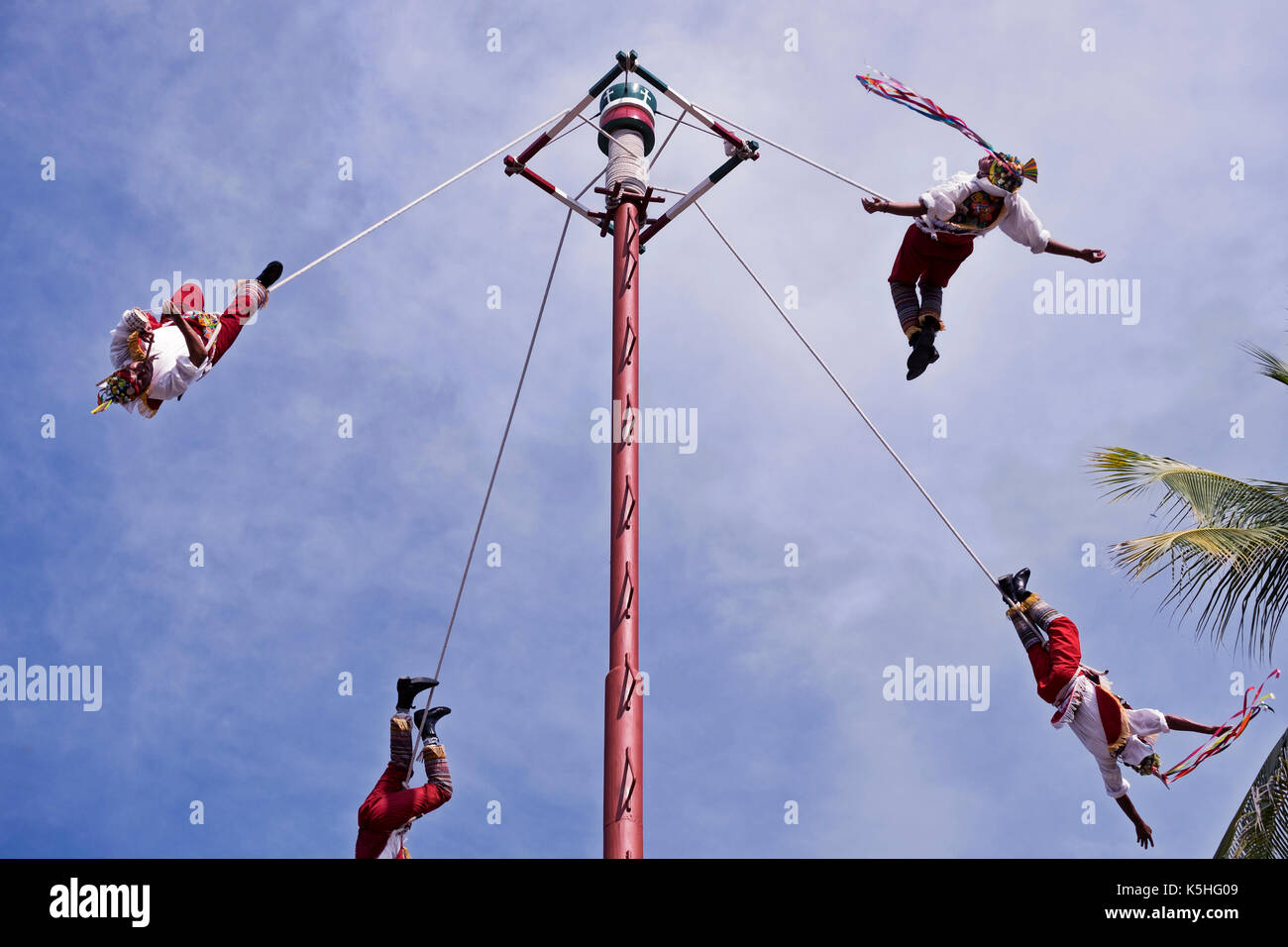 The Danza de los Voladores (Dance of the Flyers), or Palo Volador (pole flying), is an ancient Mesoamerican ceremony/ritual still performed today in M Stock Photo