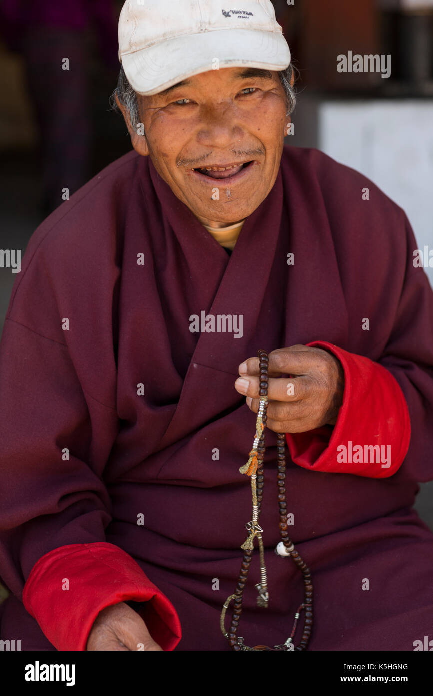 Elderly worshiper at the National Memorial Chorten in Thimphu, Western Bhutan Stock Photo