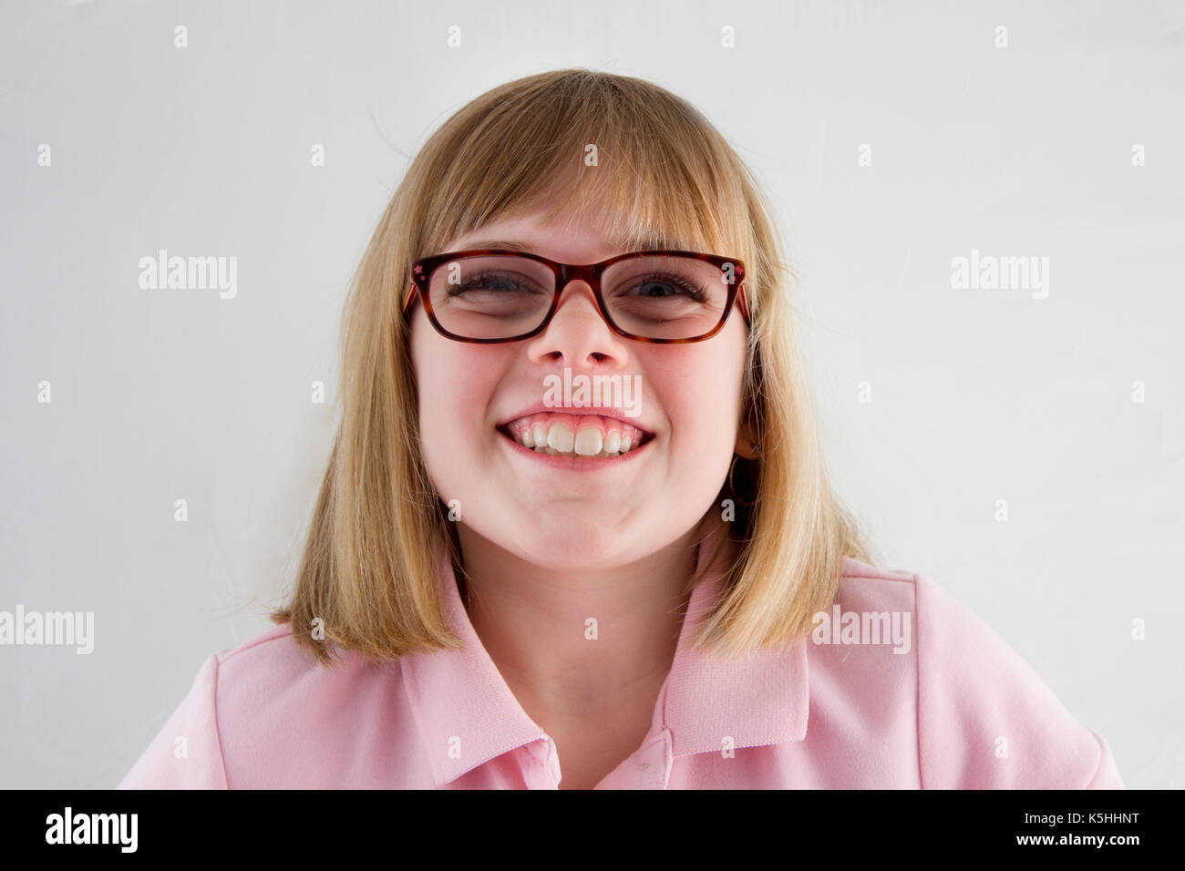 Young girl in her school uniform smiling at the camera Stock Photo
