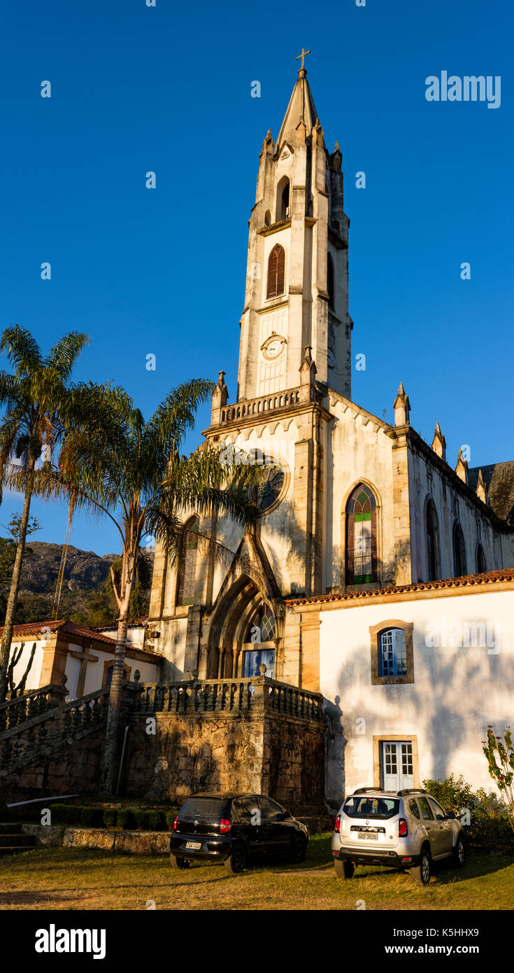 Side view of Caraca Sanctuary neo-gothic church at dusk, Catholic church, and main lodge, Minas Gerais, Brazil. Stock Photo