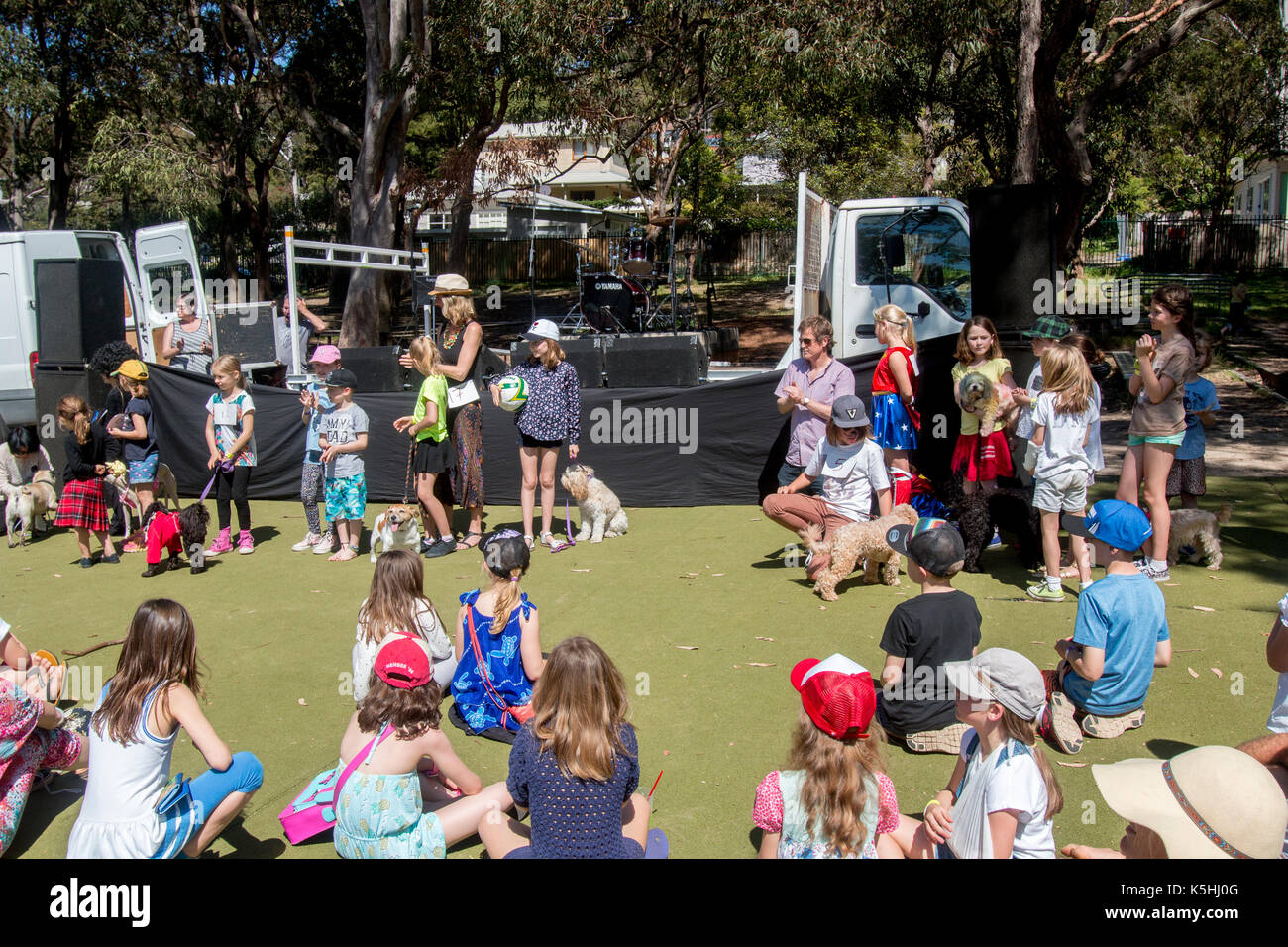 Australian primary school children with their pet dogs at a local school fete fair dog show contest, Sydney,NSW, Australia Stock Photo