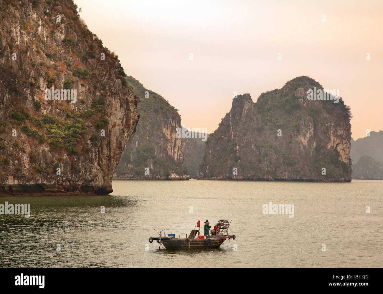 Lone fishing boat, Halong Bay, Vietnam. Stock Photo