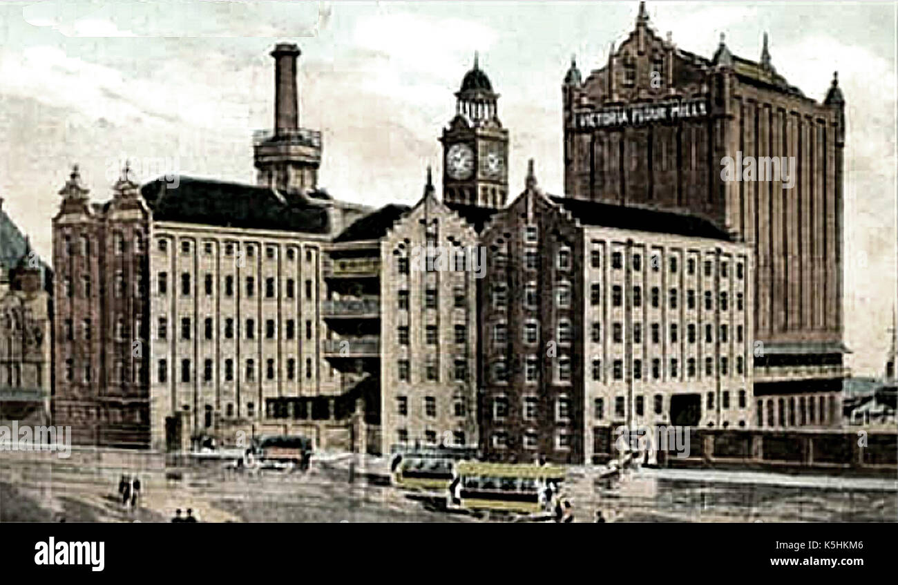 1909 - Victoria Mills  -large flour mills in the town of  'Great' Grimsby, Lincolnshire, England - Built 1899, extended 1906 - Architect Sir W.A. Gelder - The picture shows the demolished chimney & clock tower Stock Photo