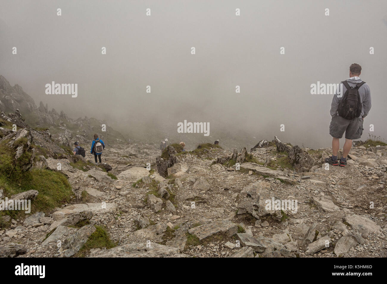 Hikers descending Snowdon mountain in Wales Stock Photo