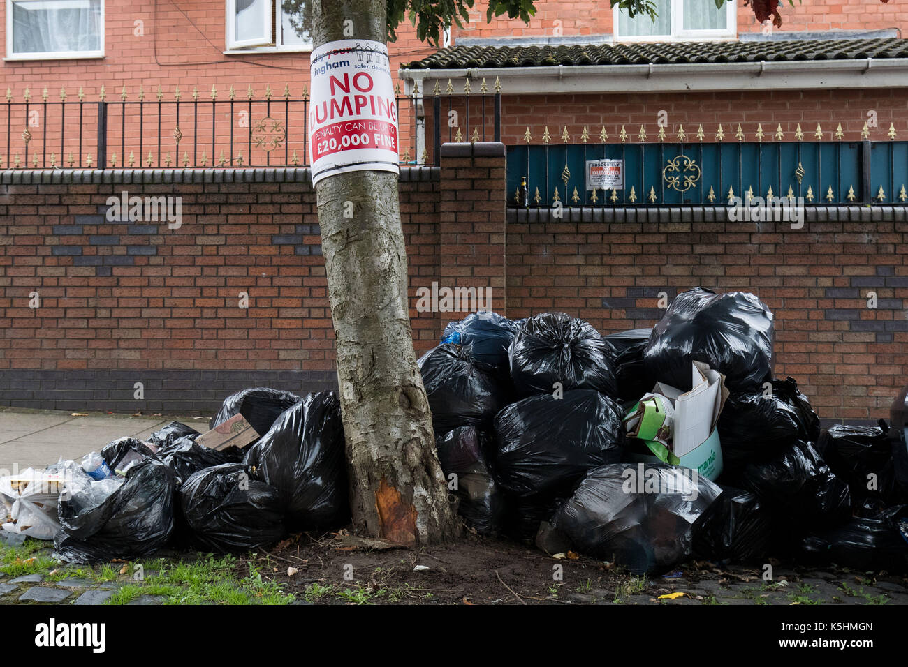 Rubbish bags piled up underneath hires stock photography and images