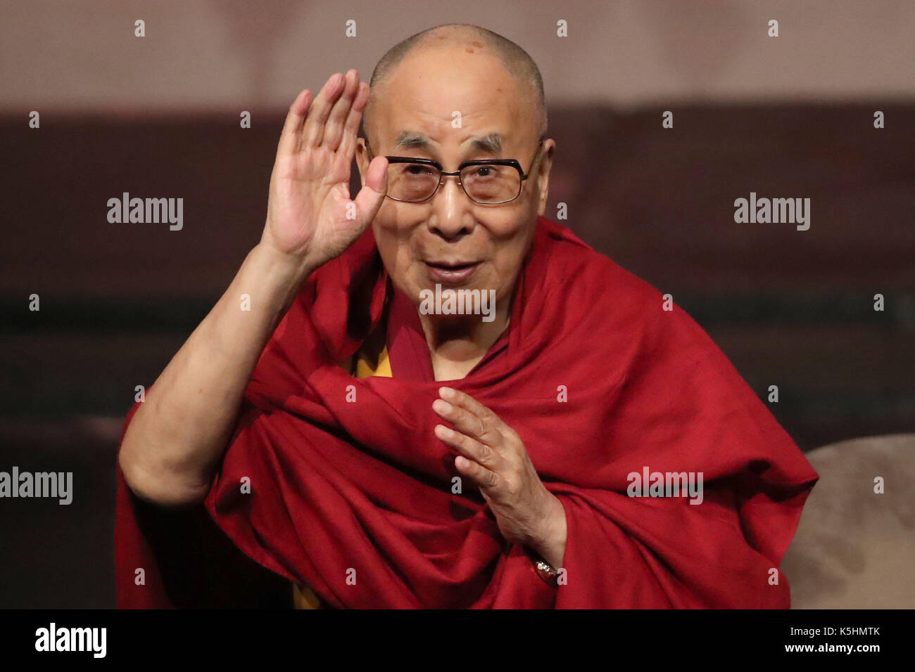 The Dalai Lama addresses a charity event marking the 20th anniversary of the charity Children in Crossfire to celebrate 20 years of the ground-breaking organisation's work, at the Millennium Forum, during a visit to Londonderry. Stock Photo