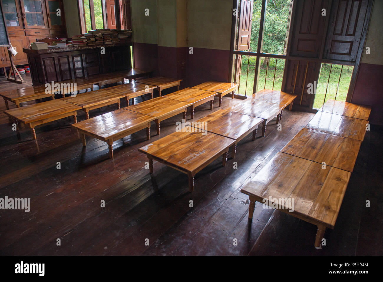 Historic old education room with brown floor and table in Myanmar Stock ...