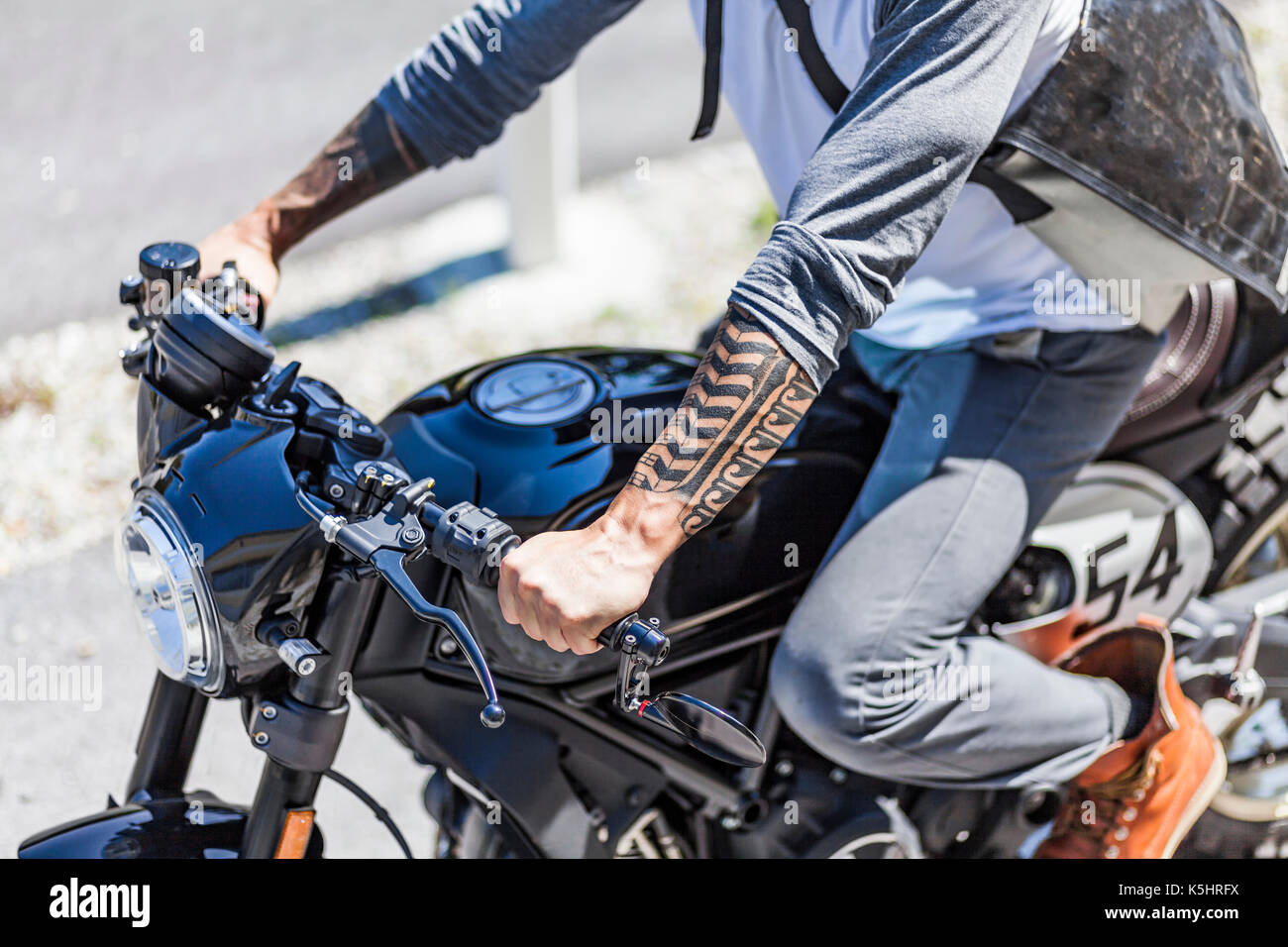 Cool Looking Tattoos On Arms Of Motorcycle Rider On Custom Made Stock Photo Alamy