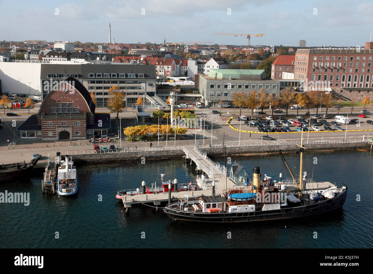 The port of Kiel, Germany between The Sweden Quay and the Baltic Sea Quay with the Maritime Museum front left Stock Photo