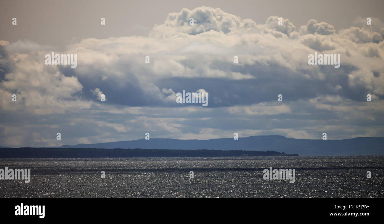 The north western shoreline of Nova Scotia, Canada as seen from a passenger ferry crossing the Northumberland Straight. Stock Photo