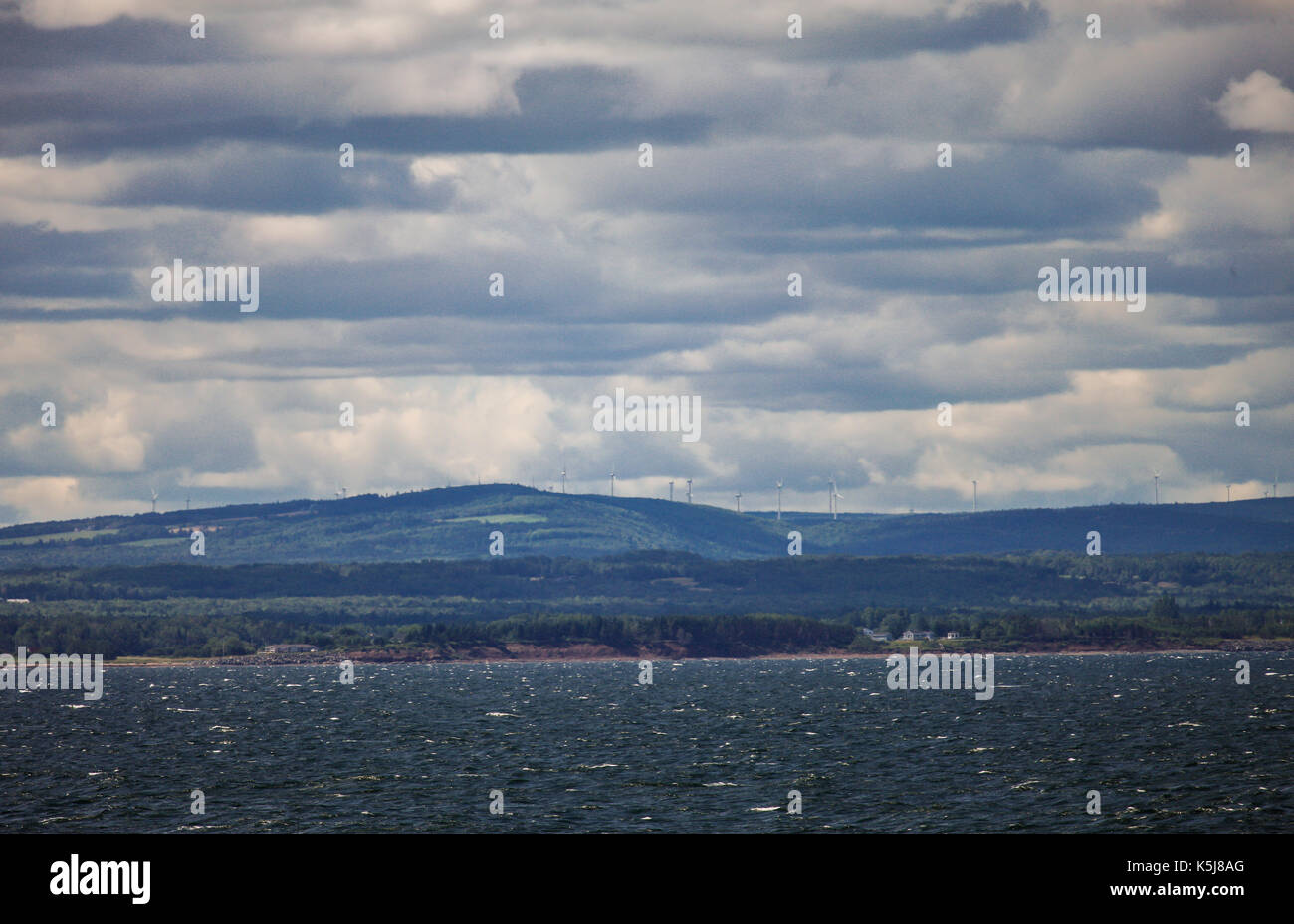 The north western shoreline of Nova Scotia, Canada as seen from a passenger ferry crossing the Northumberland Straight. Stock Photo