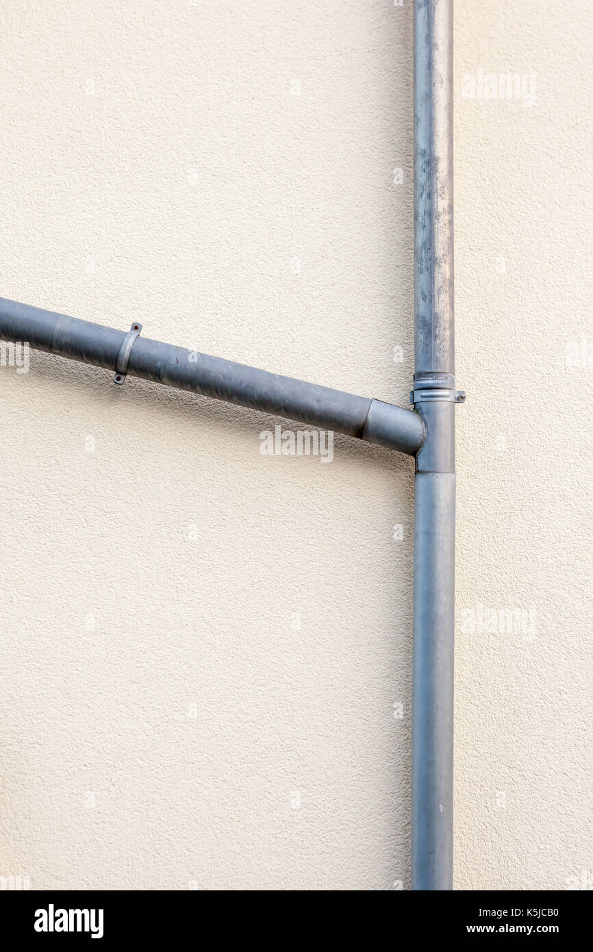 an rain drain pipe on an wall Stock Photo Alamy