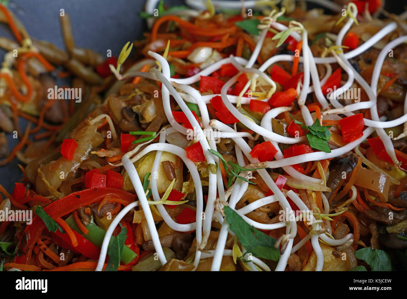 Asian traditional meal of stir fried assorted vegetables in wok pan ...