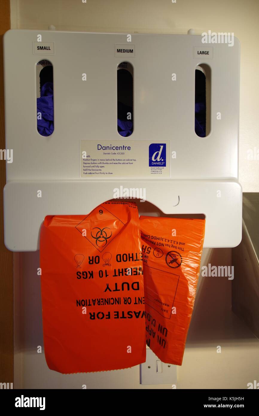 Biohazard Waste Bag Dispenser and Surgical Gloves. Modern British Hospital. 2017. Stock Photo