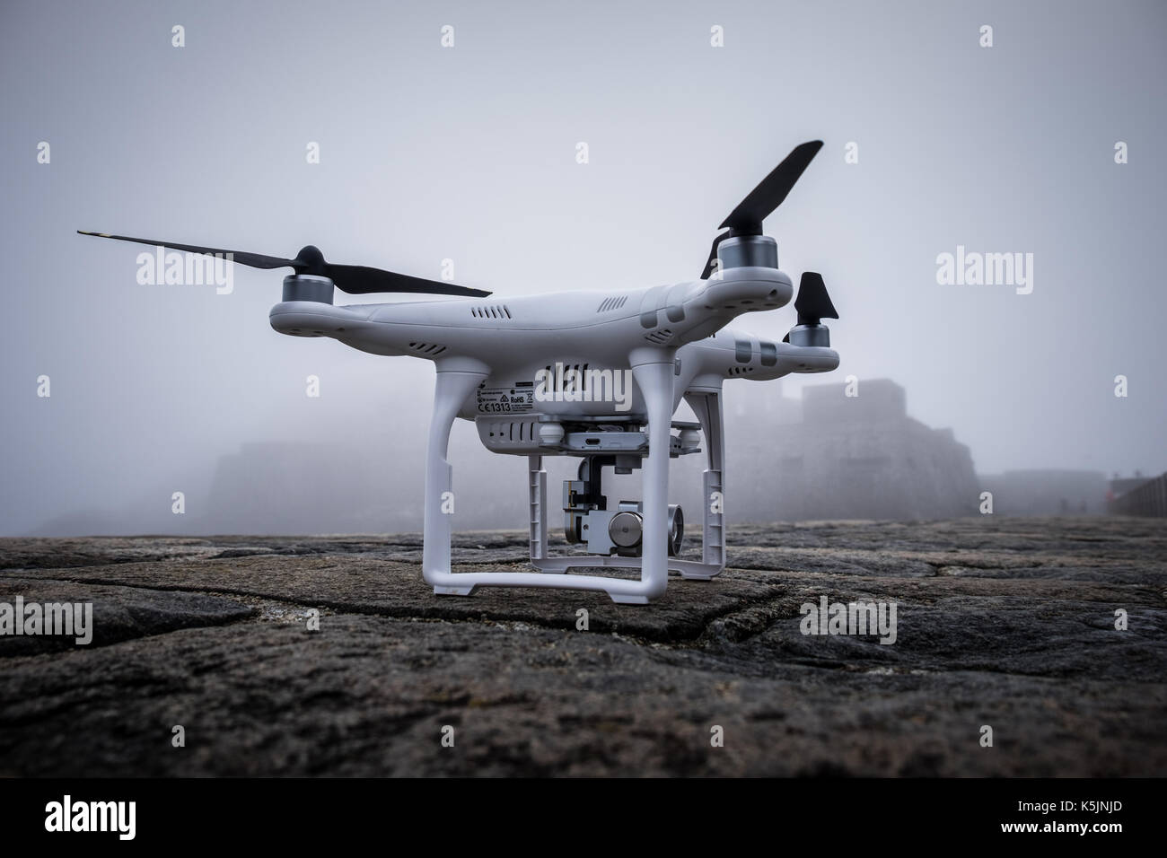 A DJI Phantom drone in foggy weather Stock Photo