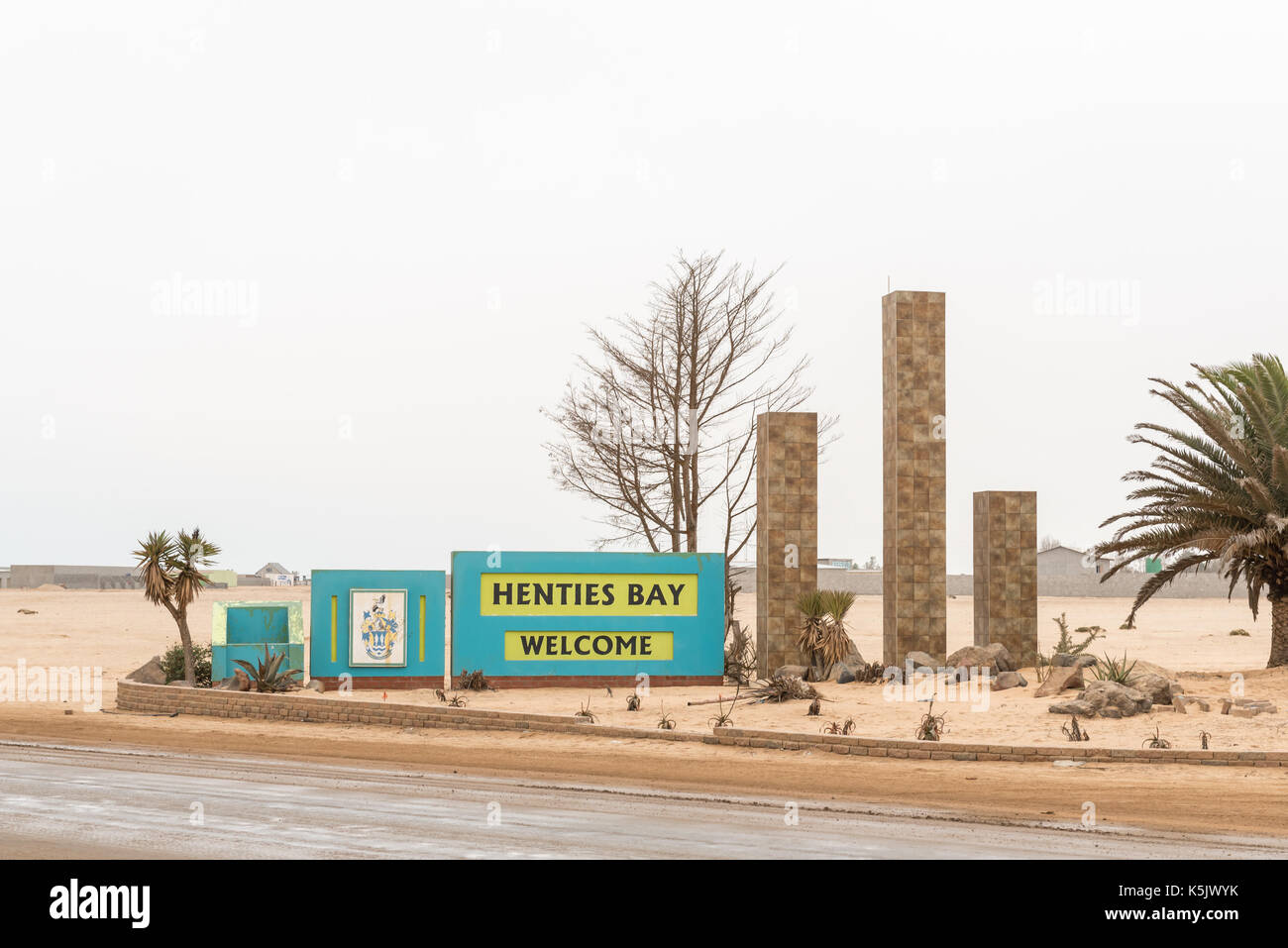 HENTIES BAY, NAMIBIA - JUNE 29, 2017: Welcome sign at the northern entrance to Hentiesbaai (Henties Bay), a well known recreational fishing town on th Stock Photo