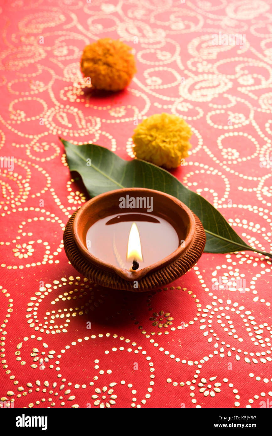 stock photo of beautiful diwali diya, isolated over decorative ...