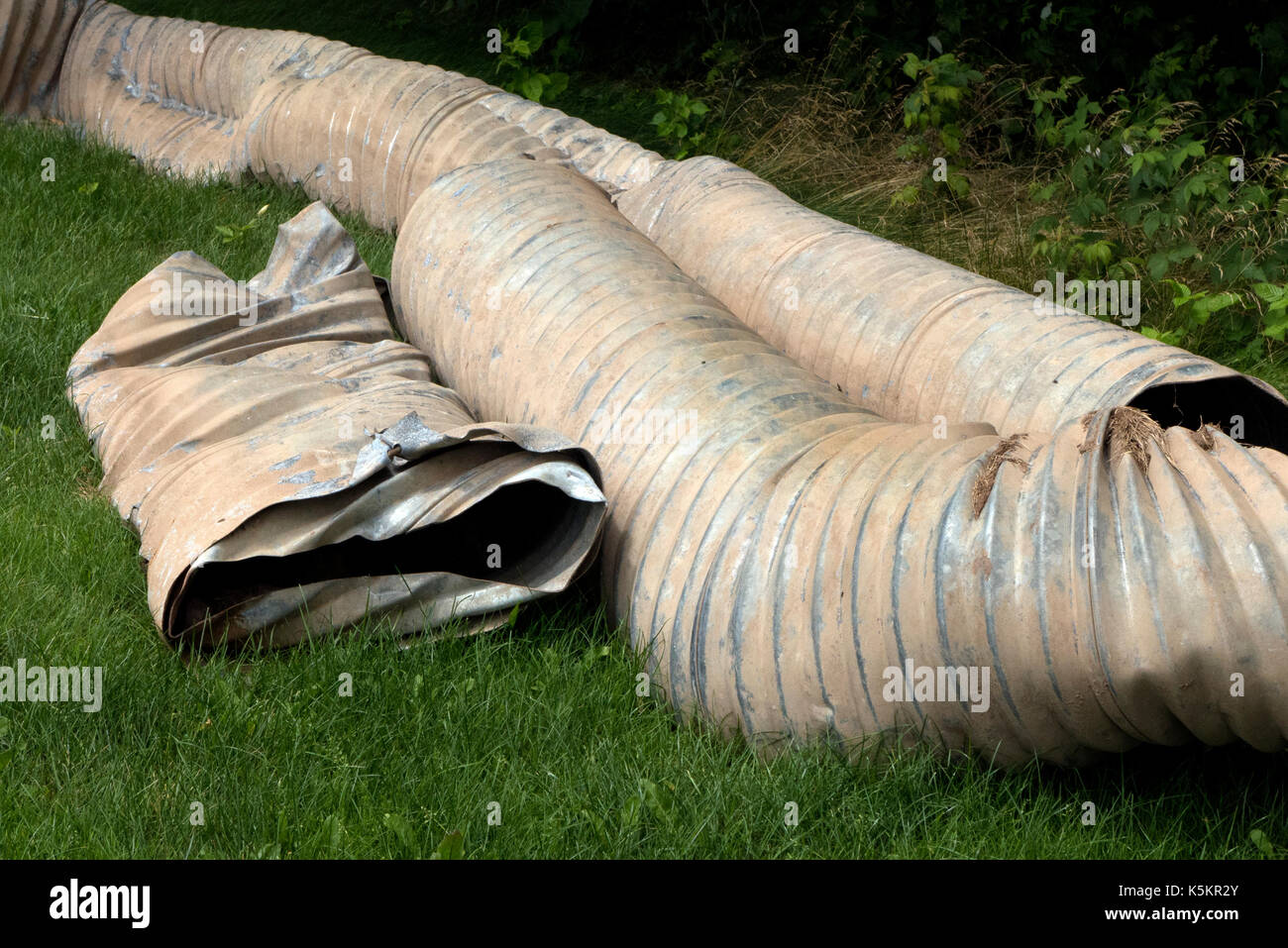 Construction site, flexible piping junked. Stock Photo