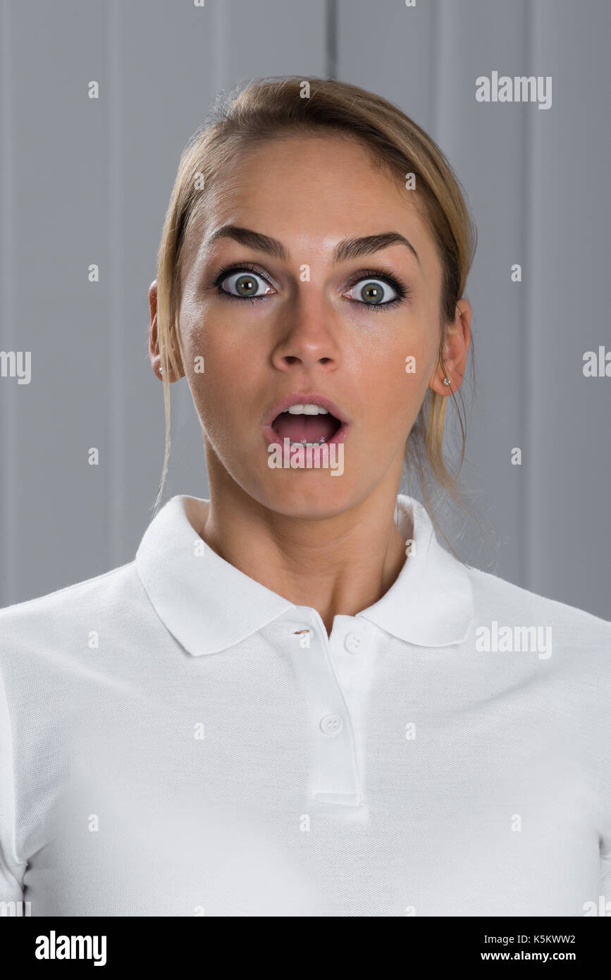 Portrait Of Surprised Young Beautiful Woman In White T-shirt Stock ...