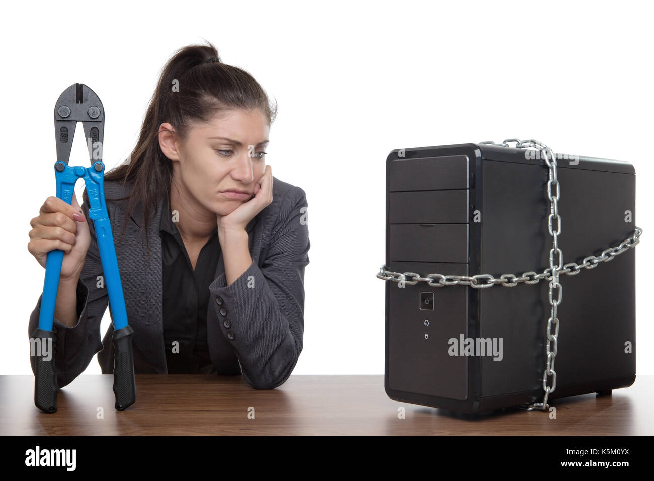 Computer locked up and business woman with holding bolt cutters trying