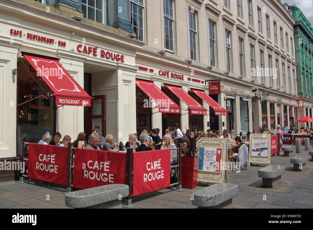 cafes and restaurants in the pedestrian precinct of Royal Exchange Square with tourists Stock Photo