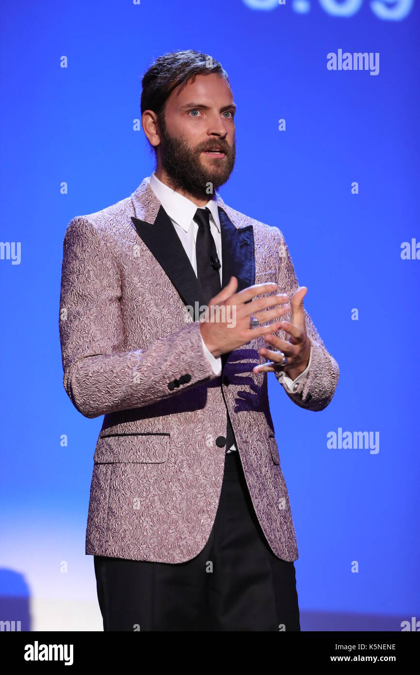 VENICE, ITALY - SEPTEMBER 09: Italian actor and host of the festival Alessandro Borghi speaks during the award ceremony of the 74th Venice Film Festival on September 9, 2017 at Venice Lido. Stock Photo