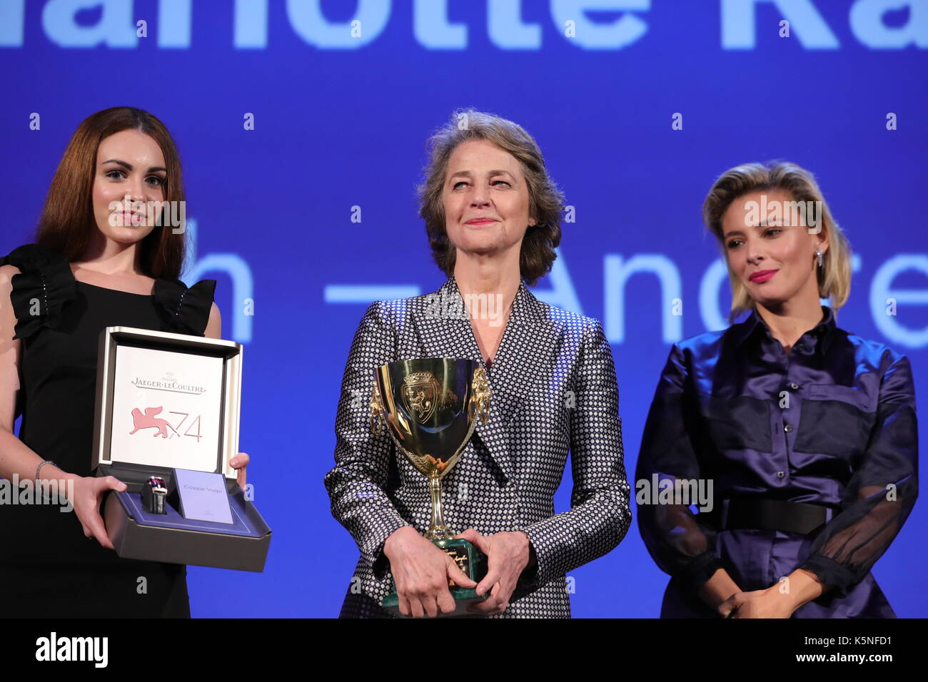 VENICE, ITALY - SEPTEMBER 09: Charlotte Rampling receives the Coppa Volpi for Best Actress Award for 'Hannah' from 'Venezia 74' jury member Jasmine Trinca (R) and a Jaeger-LeCoultre Unique engraved Reverso watch during the Award Ceremony of the 74th Venice International Film Festival at Sala Grande on September 9, 2017 in Venice, Italy. Stock Photo